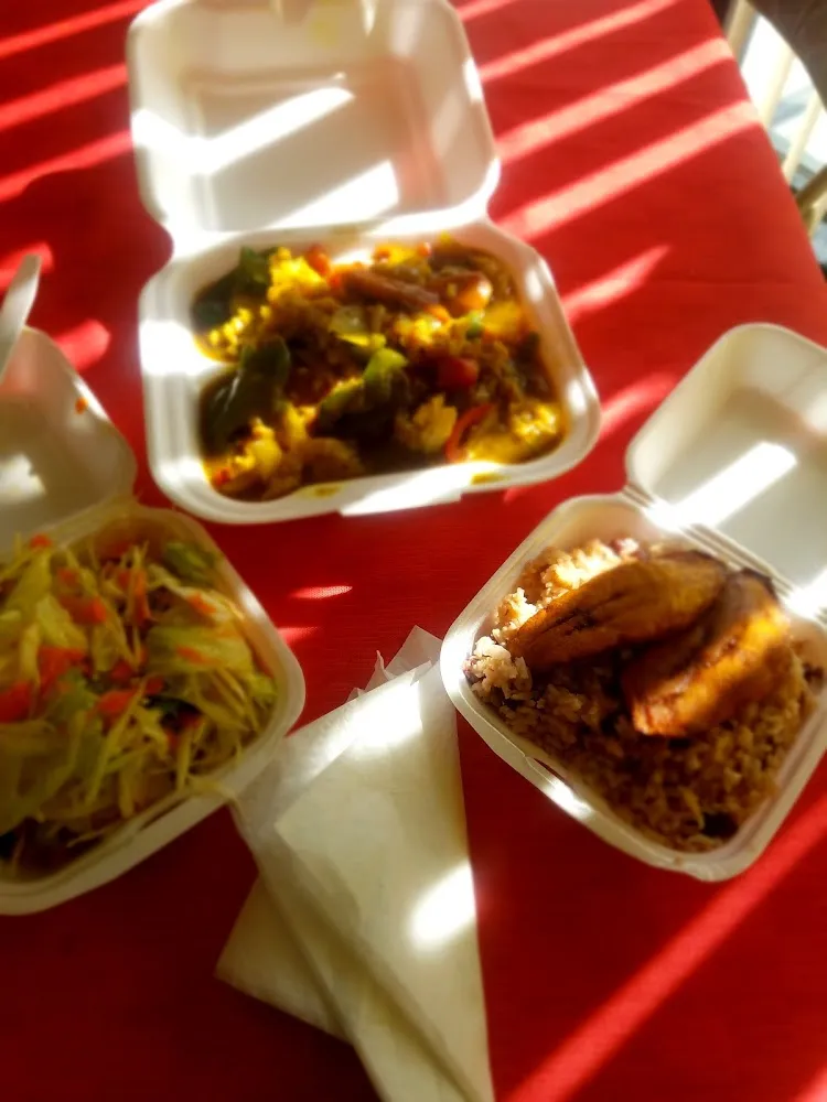 Curry Conch with Rice and Peas Sweet Plantains and Salad
